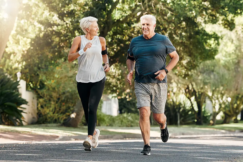 senior man and woman jogging